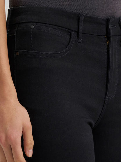 a close up of a pair of black bespoke jeans
