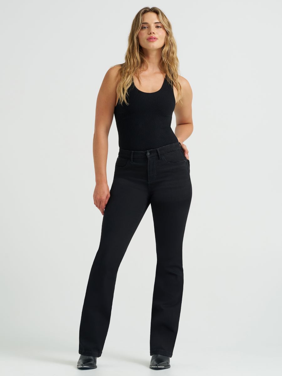 a woman dressed in black on an off white background