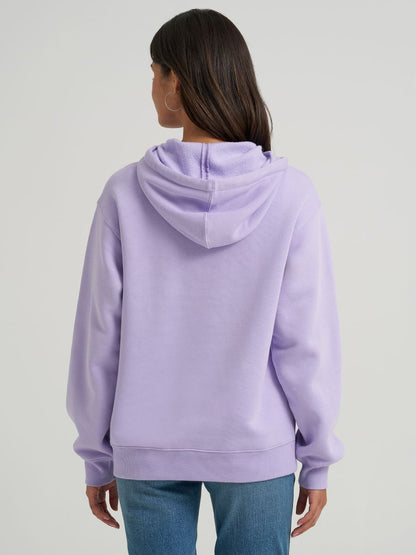 Person wearing a light purple hoodie on a plain background
