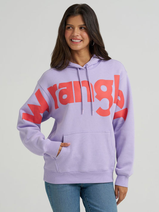 Woman wearing a lavender hoodie with red 'Wrangler' logo on a plain background
