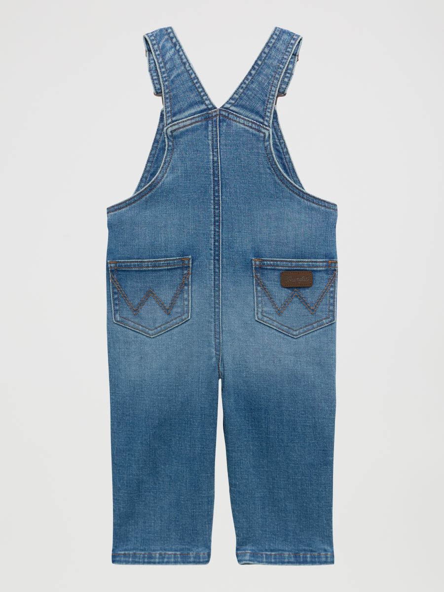 Blue denim baby overalls on a light gray background