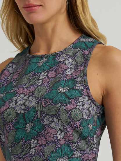 Close-up of a sleeveless top with floral pattern on a plain background