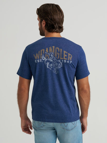 Man wearing a blue Wrangler t-shirt with branding on the back against a plain background