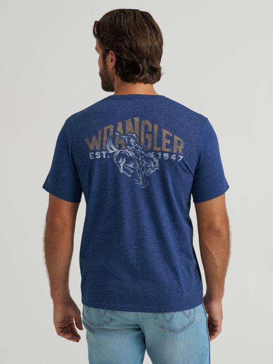 Man wearing a blue Wrangler t-shirt with branding on the back against a plain background