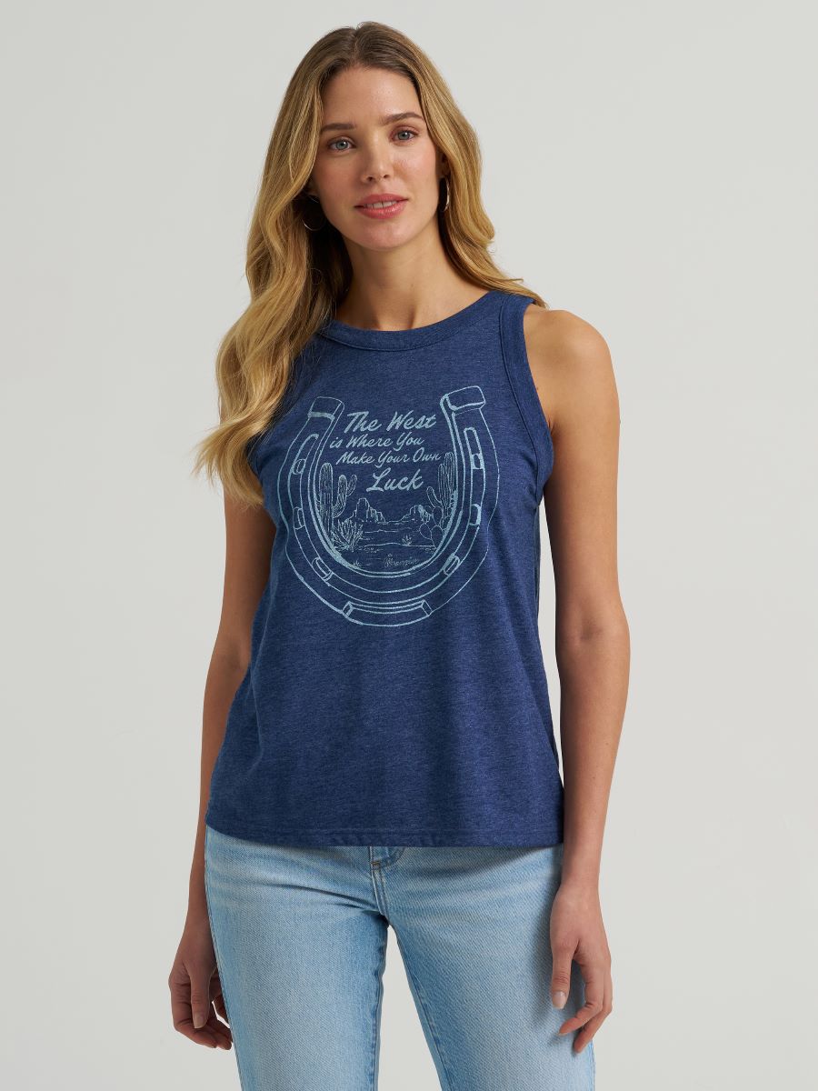 Woman wearing a navy blue Wrangler sleeveless top with a graphic design on a light gray background