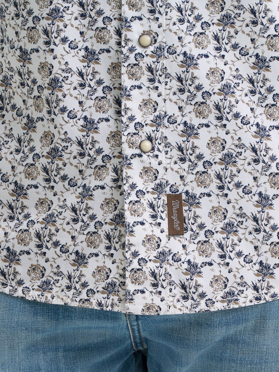 Floral patterned shirt with a Wrangler brand label on a white background