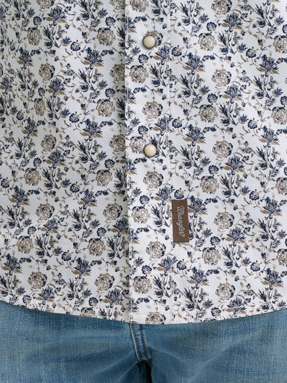 Floral patterned shirt with a Wrangler brand label on a white background