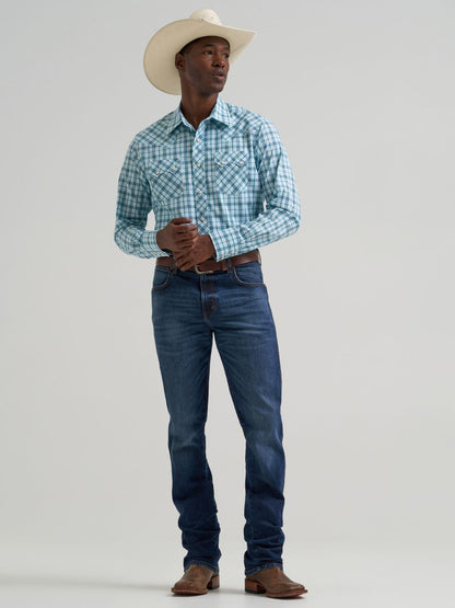 Man wearing a plaid Wrangler shirt, jeans, and cowboy hat on a plain background