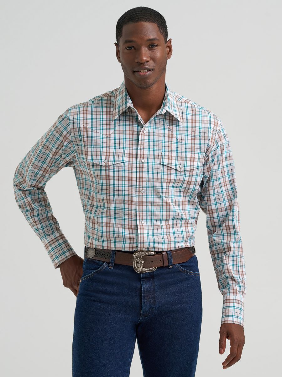 Man wearing a brown plaid Wrangler shirt and jeans on a gray background