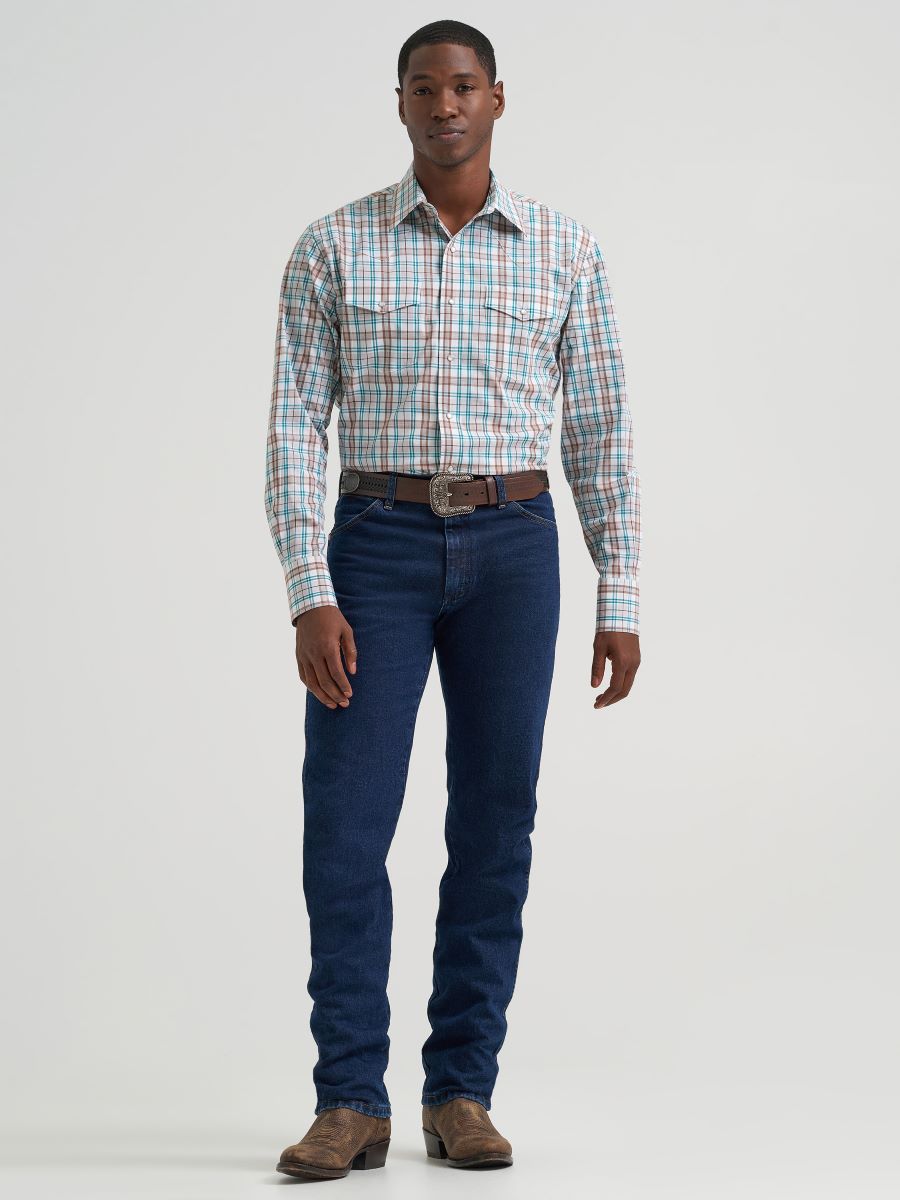 Man wearing a brown plaid Wrangler shirt and blue jeans on a white background