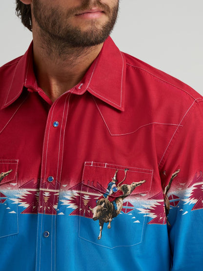Red and blue Wrangler shirt with bull design on a gray background