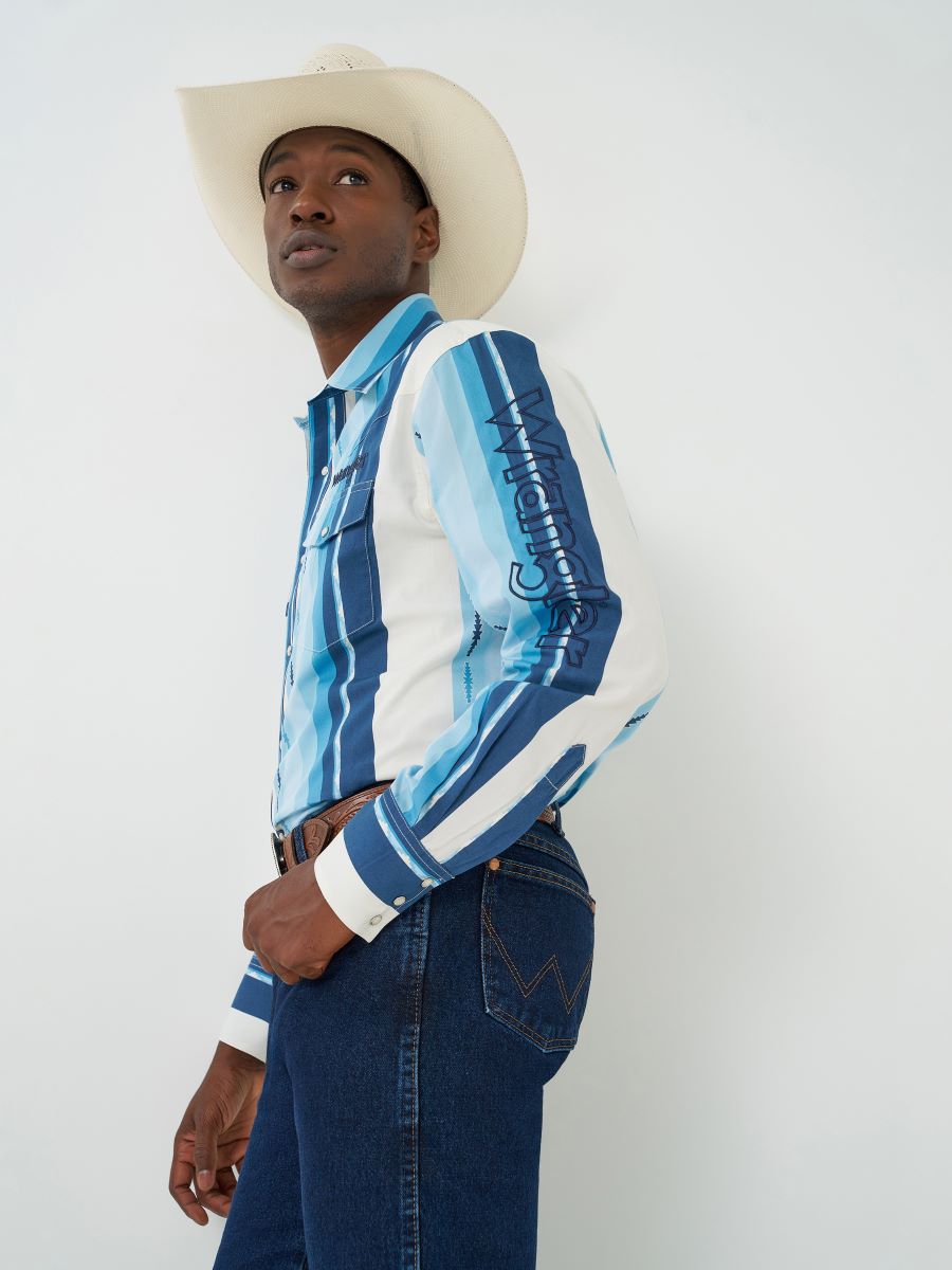 Person wearing a blue and white striped Wrangler shirt with cowboy hat on a white background