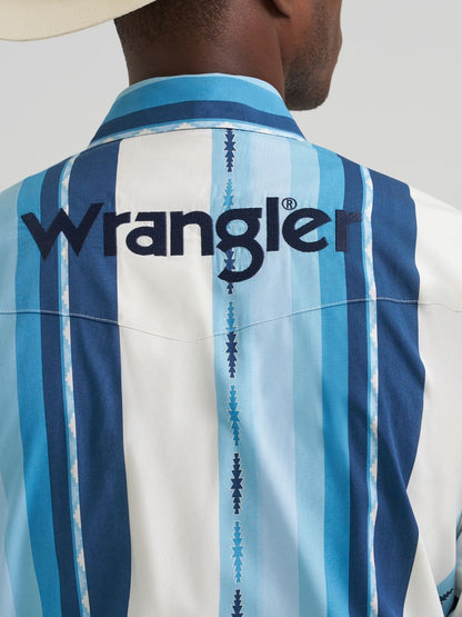 Close-up of a blue striped shirt with Wrangler logo on a plain background