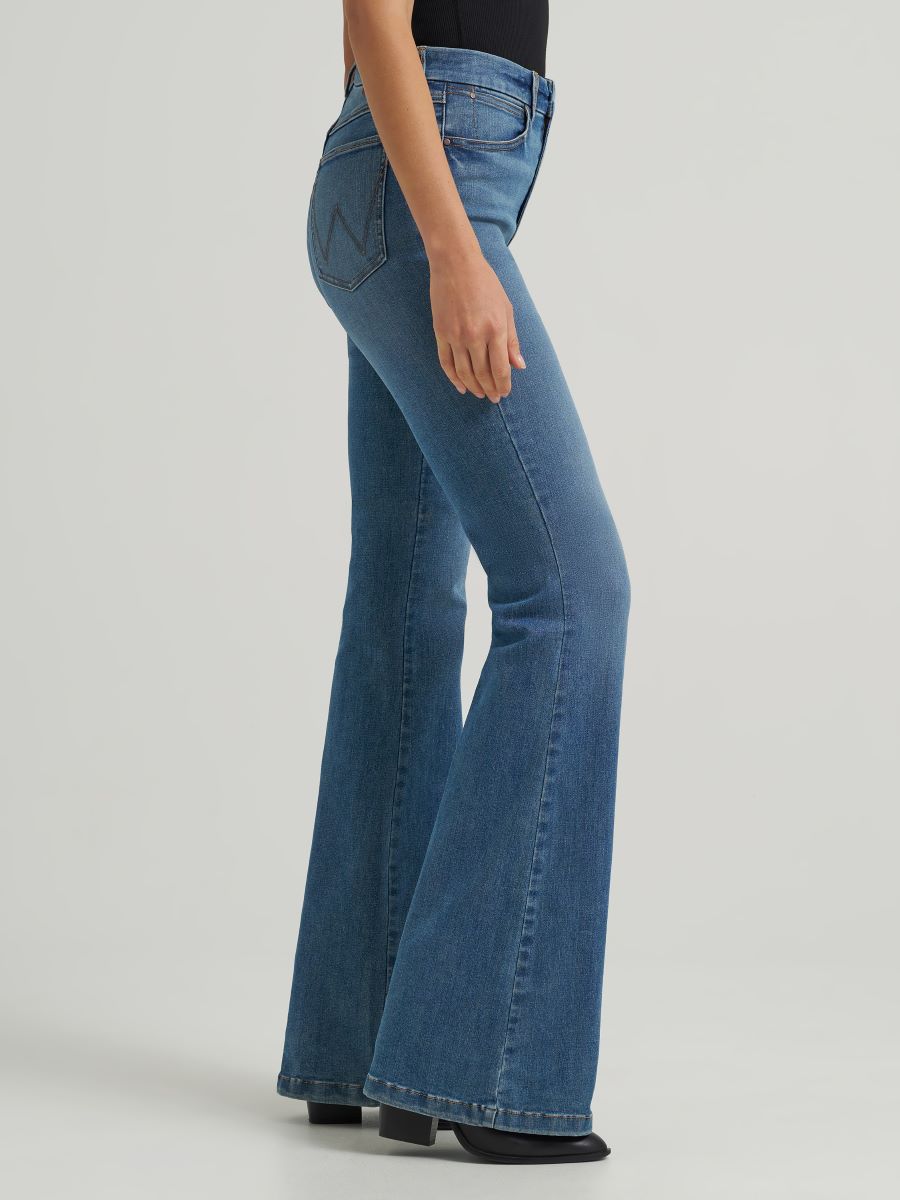Blue jeans worn by a person on a white background