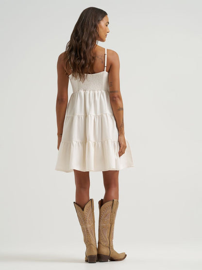 woman wearing white Wrangler dress on a white background