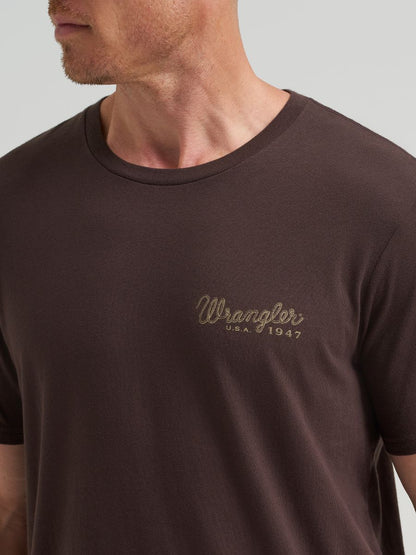 Brown t-shirt with Wrangler logo on a gray background
