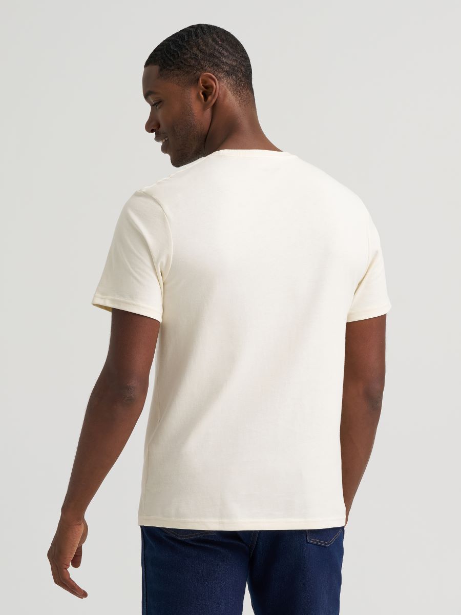 Man wearing a plain white Wrangler T-shirt against a light gray background