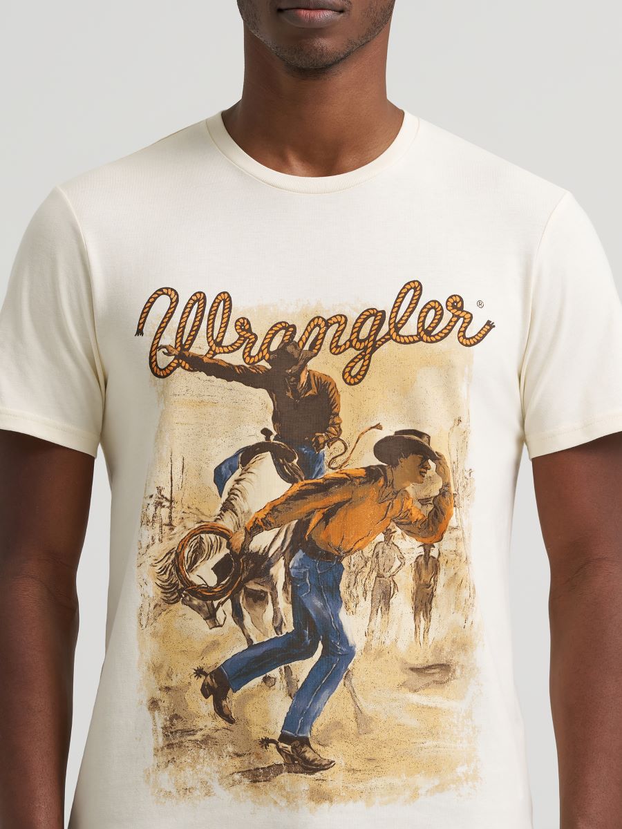 Person wearing a Wrangler t-shirt with a graphic design of a cowboy on a horse.