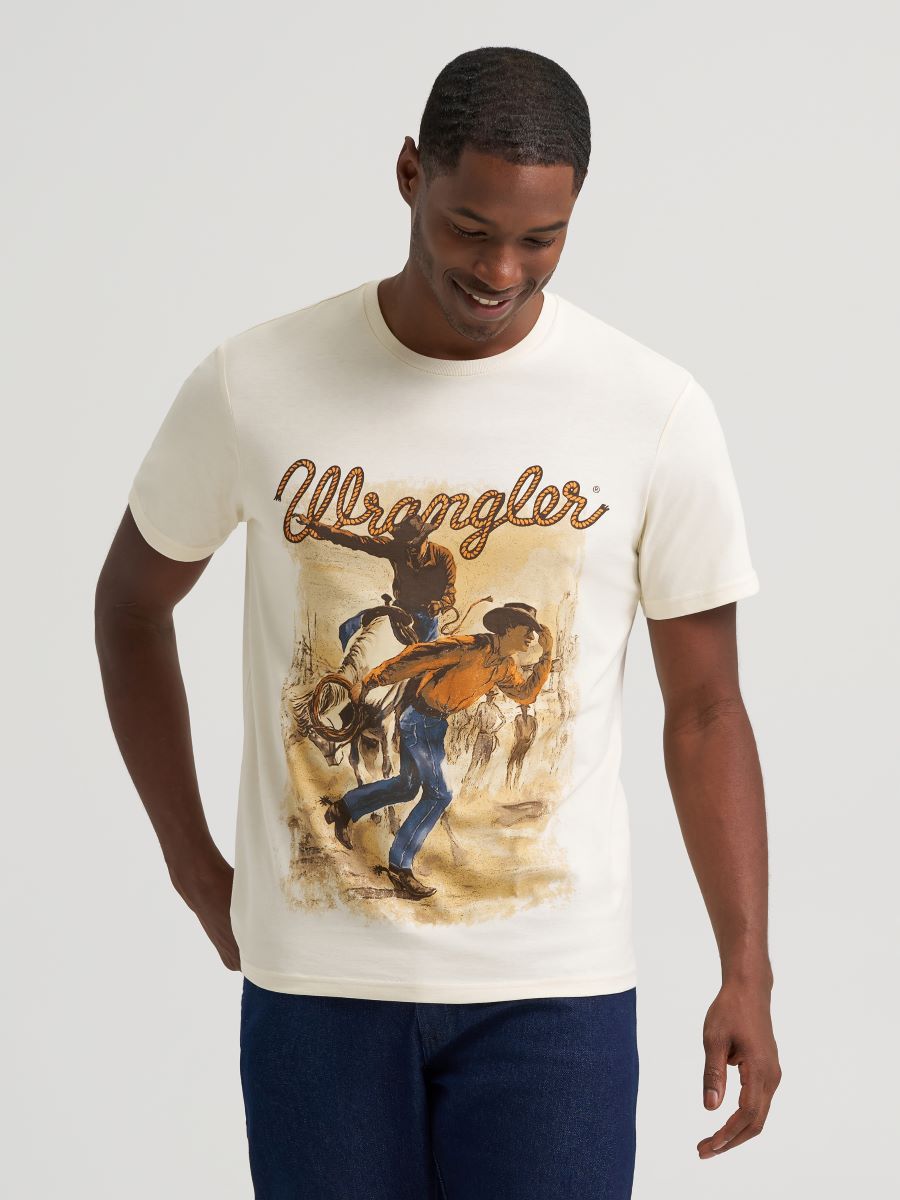 Man wearing a Wrangler t-shirt with a graphic design on a plain background