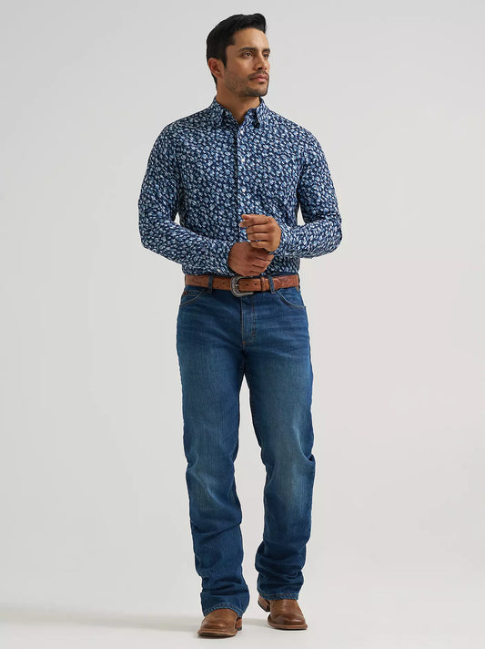 Man wearing a blue Wrangler shirt and blue jeans on a white background