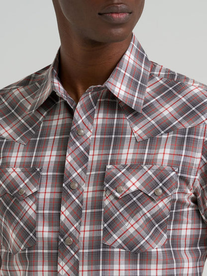 Wrangler Plaid shirt worn by a person on a plain background