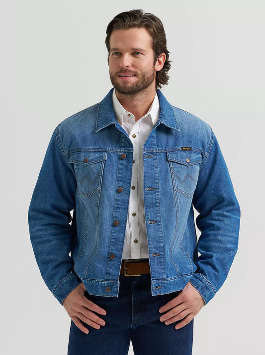 Man wearing a Wrangler denim jacket, blue jeans and a white shirt on a white background