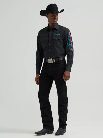 Person wearing a black Wrangler shirt with branding on a gray background