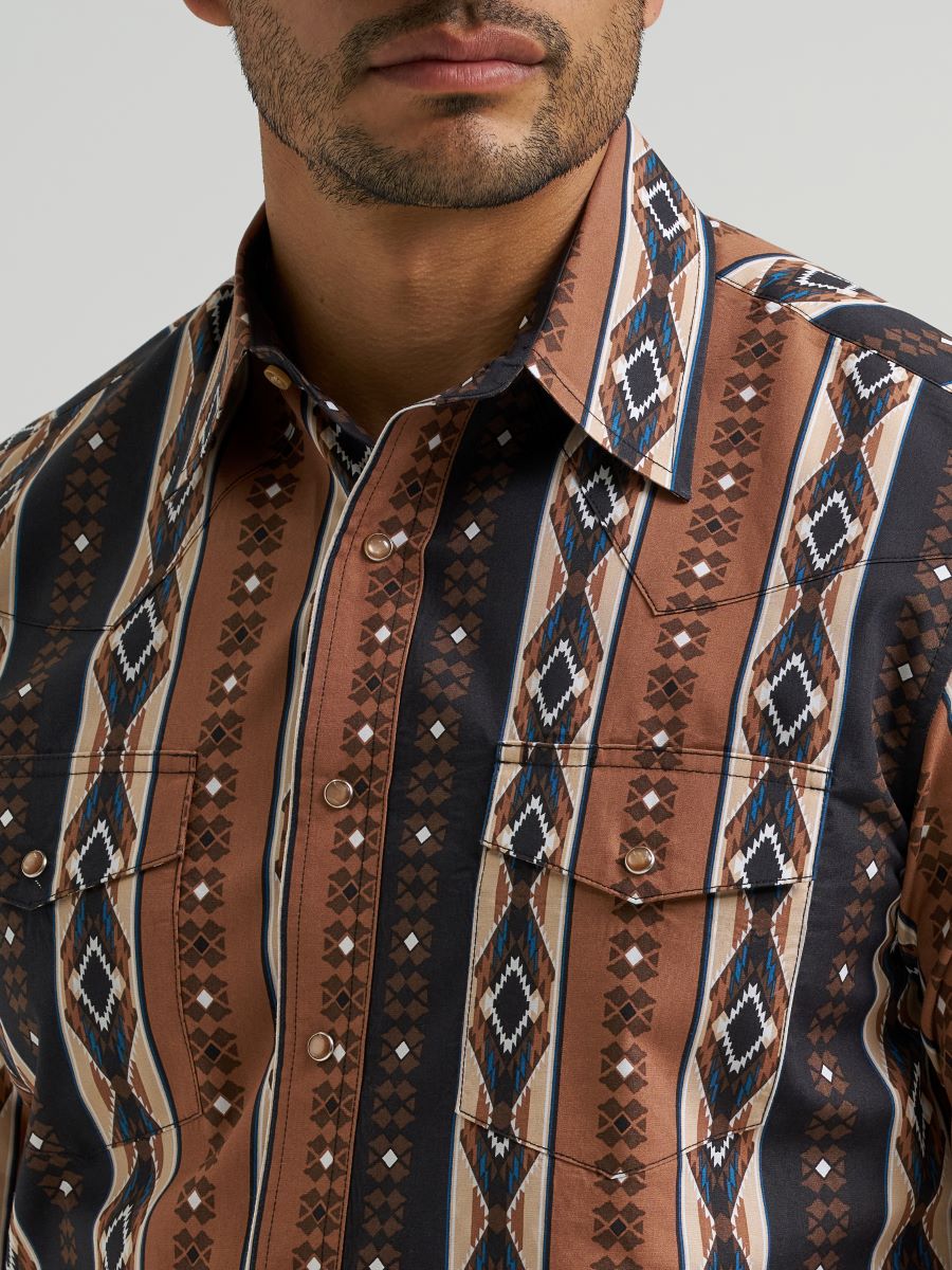 Close-up of a patterned Wrangler shirt with a neutral background
