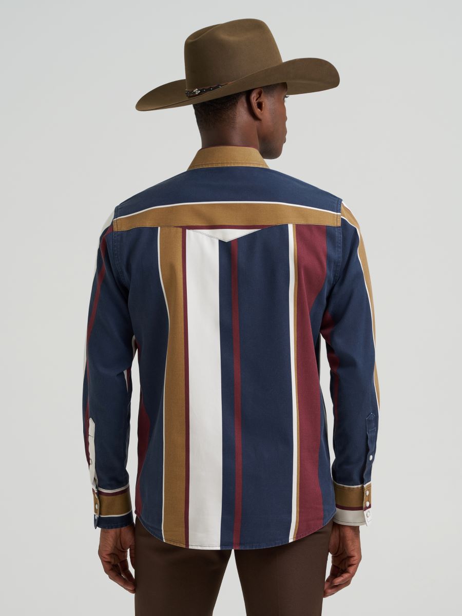 Person wearing a striped Wrangler shirt and cowboy hat on a plain background