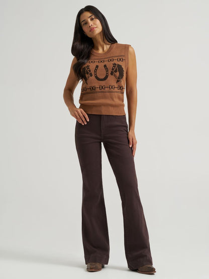 A woman modeling a sleeveless Wrangler brown knit sweater vest with a black graphic print and dark brown wide-leg pants against a light gray studio background.
