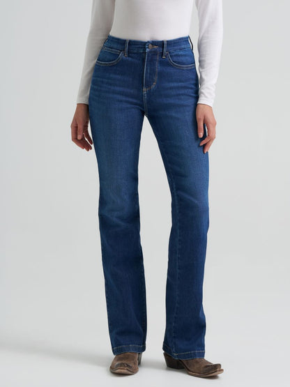 Person wearing blue Wrangler jeans on a white background