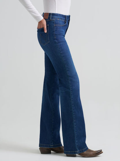 Person wearing blue Wrangler jeans on a white background