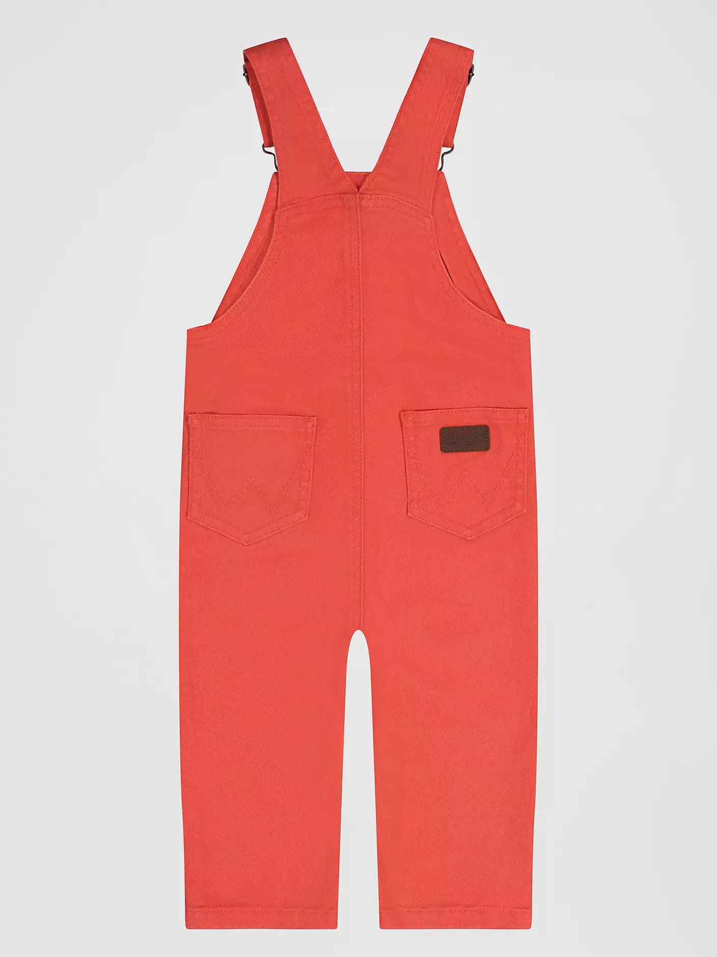 pink Wrangler infant overalls on a light gray background