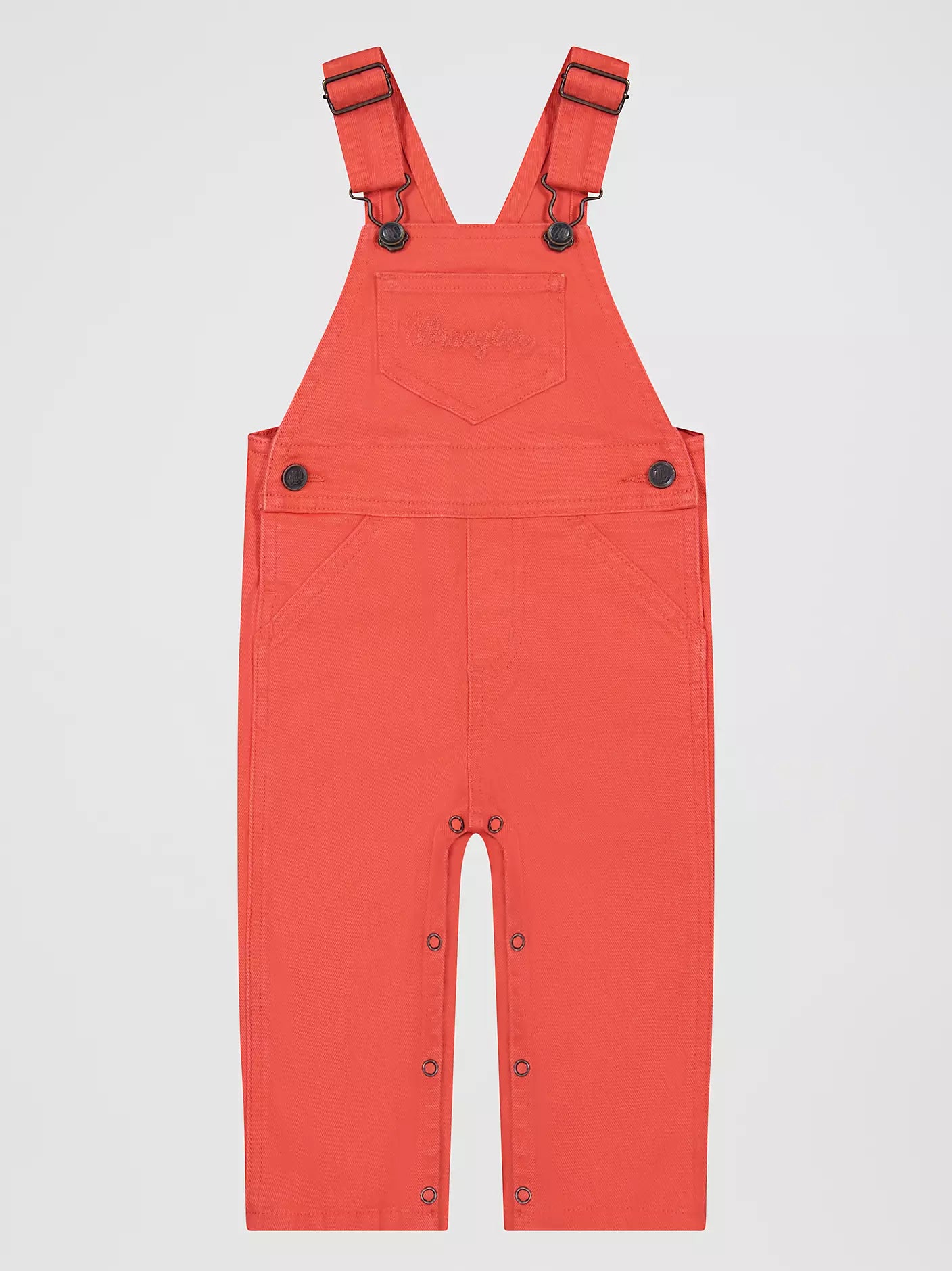 pink Wrangler infant overalls on a light gray background