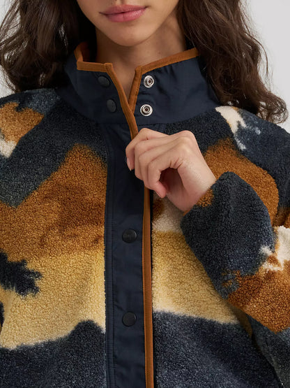 Close up of a woman wearing a Wrangler shera fleece sweater with snap closure on a white bakground