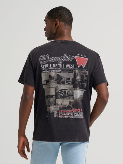 Man wearing a black Wrangler tshirt with 'Spirit of the West' and photos printed on it, and blue jeans on a grey background