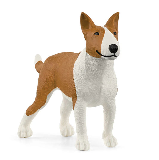 Schleich toy dog figurine with brown and white color pattern on a white background
