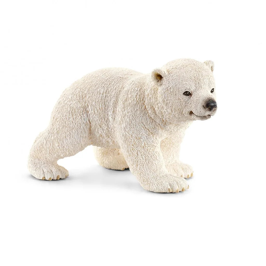 Small polar bear cub figurine from Schleich on a white background