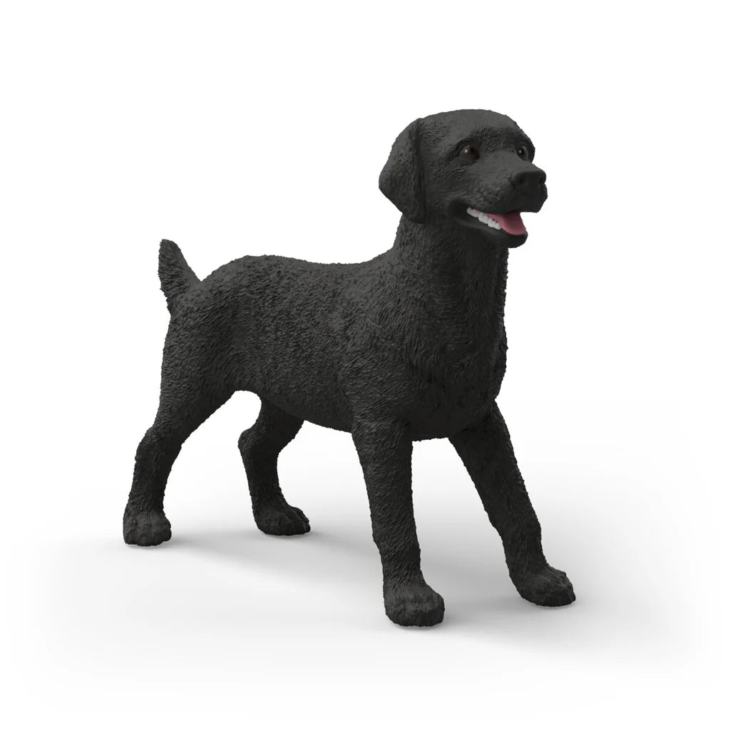 SchleichBlack dog figurine on a white background