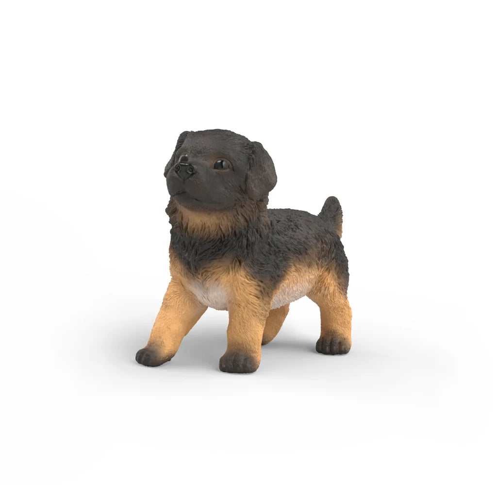 Schleich puppy figurine on a white background
