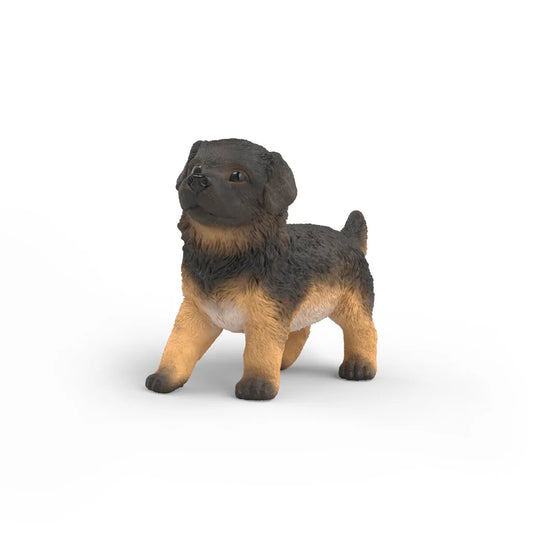Schleich puppy figurine on a white background