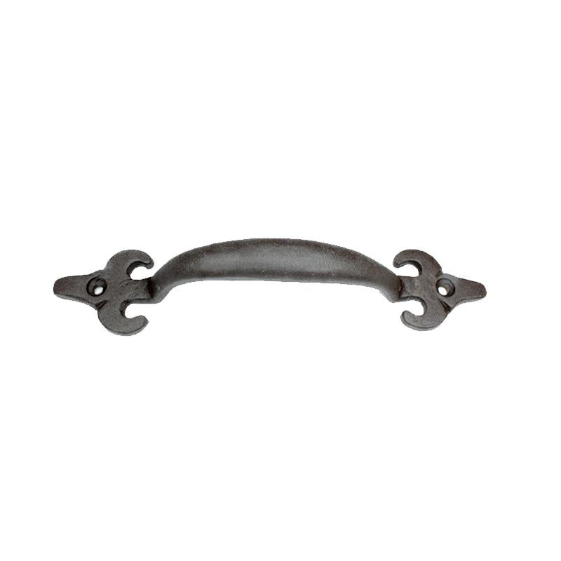 Small cast iron Fleur de lis drawer handle by Koppers on a white background