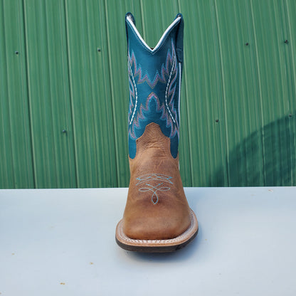 a kids boot with a teal upper and tan leather foot, featuring a rubberized outsole and horseman heel.