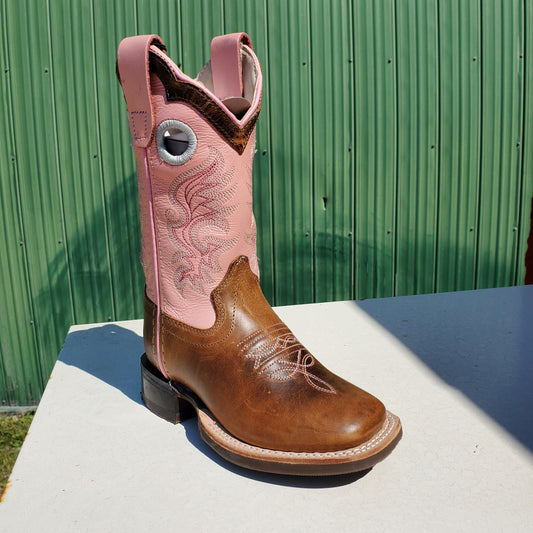 A children's boot with pink upper and brown toe, featuring a leather foot and rubberized outsole.