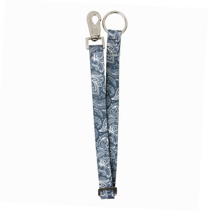 black paisley printed nylon webb strap with a clip and hardware loop on a white background