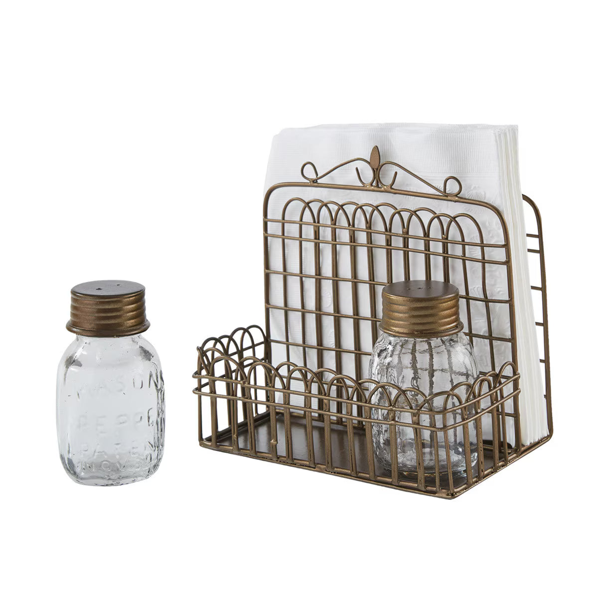 An antique bronze wire basket napkin holder with napkins and two small clear glass salt and pepper shakers with bronze screw-top lids, by Park Designs shown on a white background