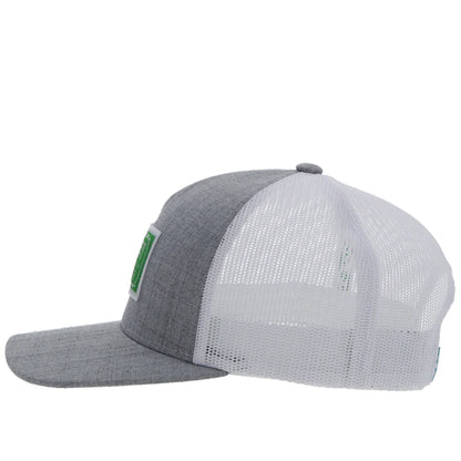 a chambray grey and white cap by hooey with a green patch