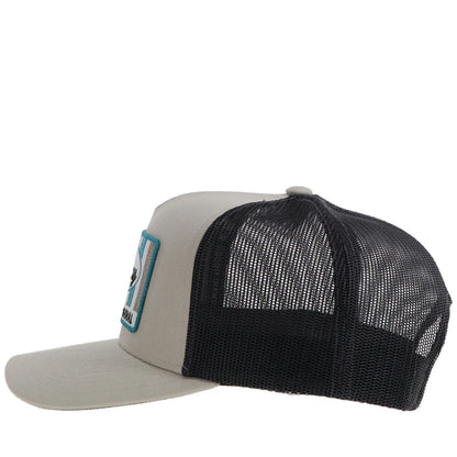Trucker Hooey hat with beige front and black mesh back on a white background