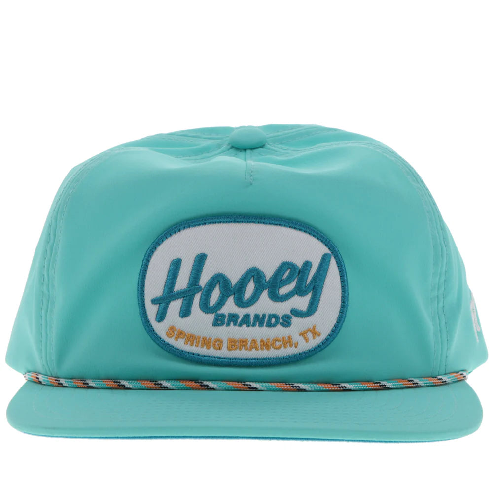 a turquoise slouchy cap by hooey with a patch that says 'hooey brands'