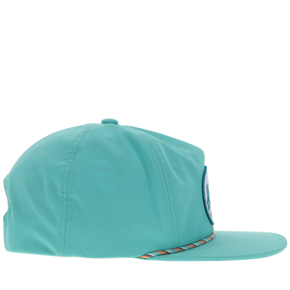 a turquoise slouchy cap by hooey with a patch that says 'hooey brands'